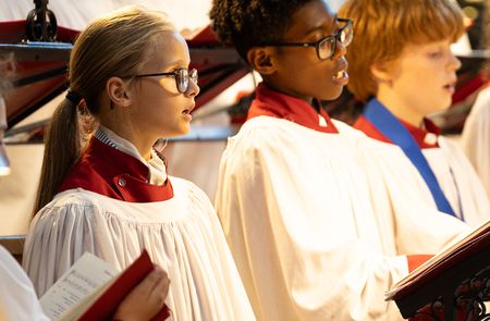 Choir children singing in choir in cathedral