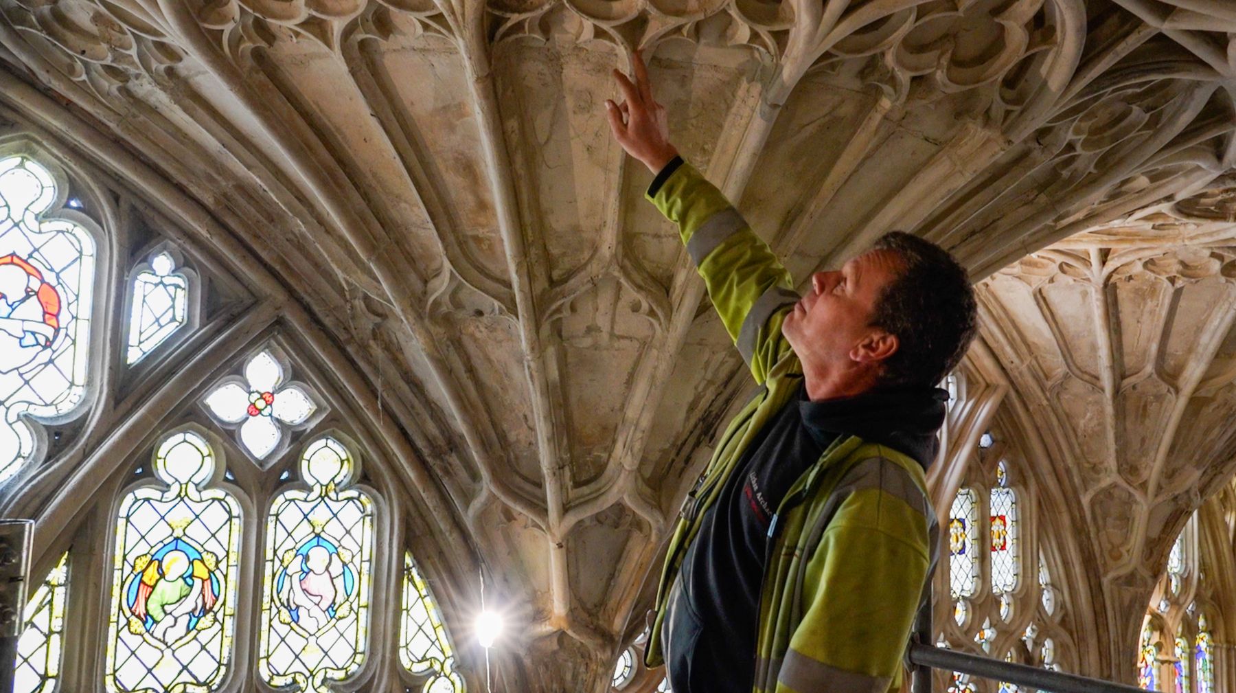 Chiz Harward in the Cloister of Gloucester Cathedral examining the fan vaulting