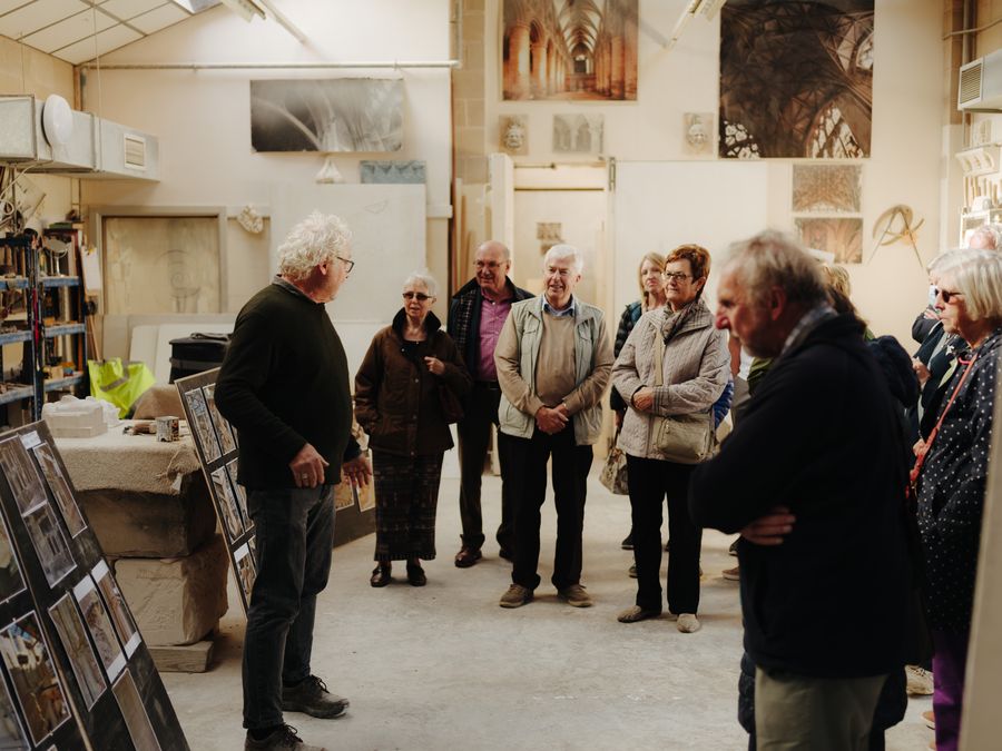 Stonemason leading a tour