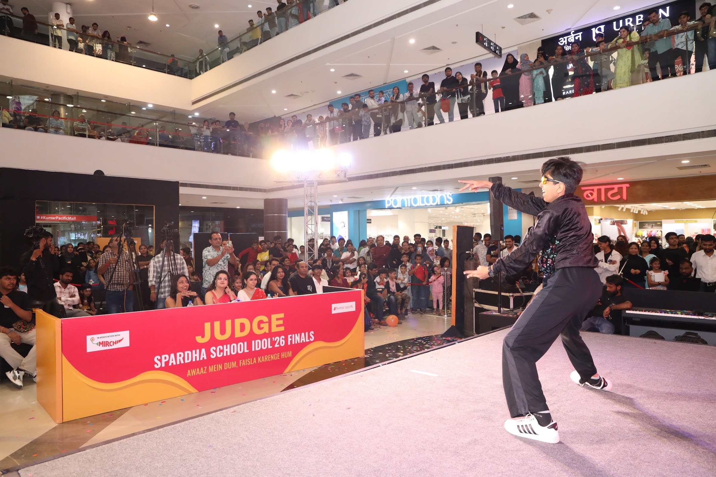 Student dancing on the School Idol 2026 finals stage in front of the audience