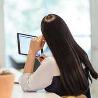 woman-studying-on-tablet-alone