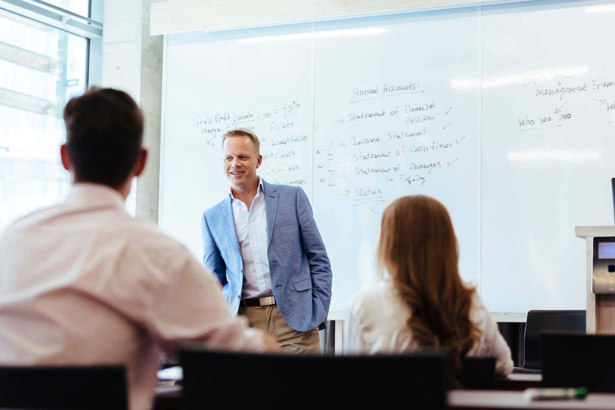 man-presenting-white-board