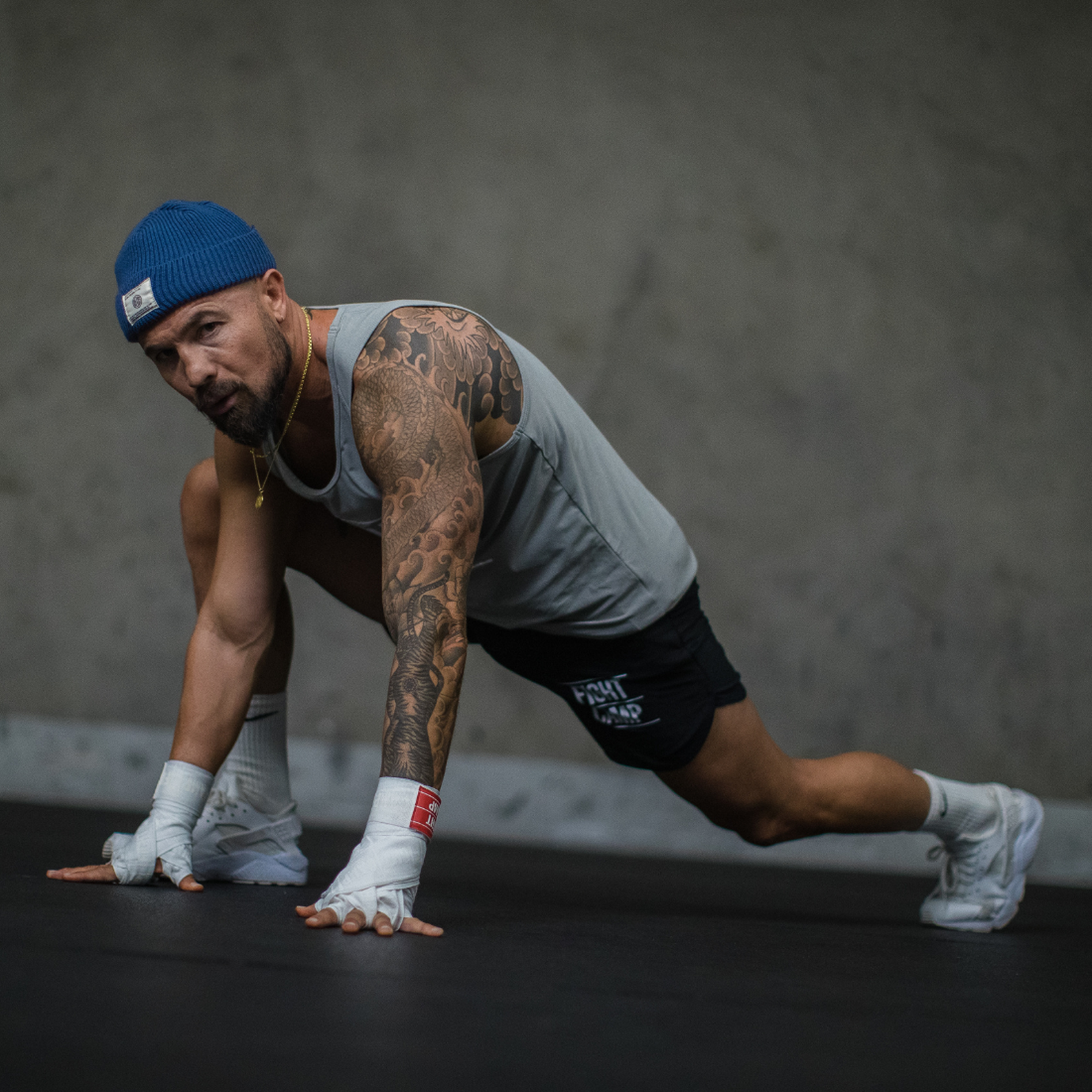 Aaron Swenson doing a runner's lunge hold