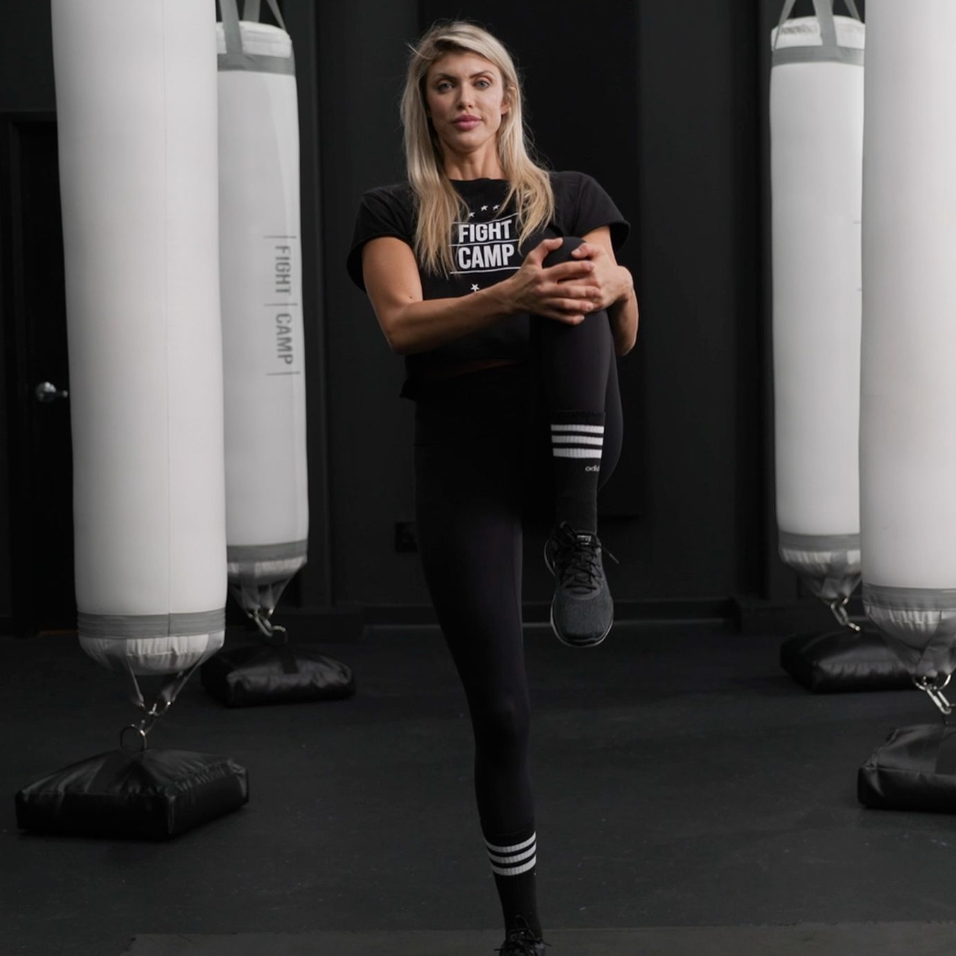 Shanie Smash Doing a Knee to Chest Pull Stretch