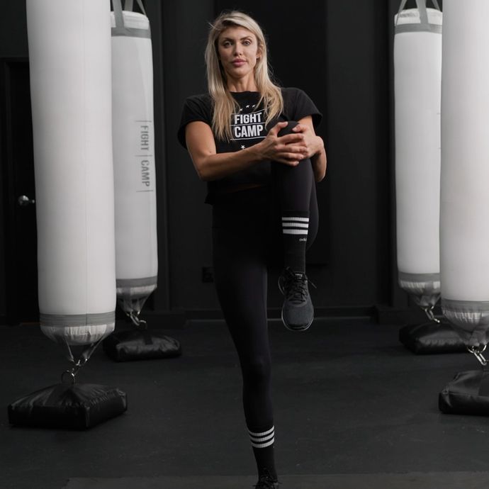 Shanie Smash Doing a Knee to Chest Pull Stretch
