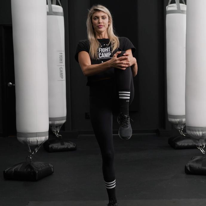 Shanie Smash Doing a Knee to Chest Pull Stretch