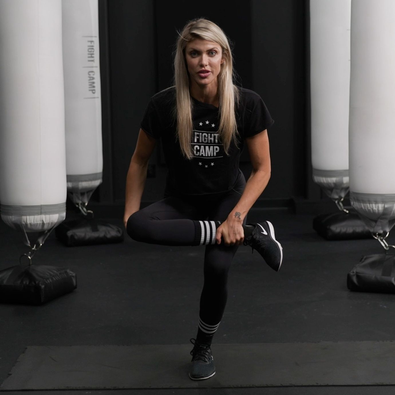 Shanie Smash Doing a Leg Over Knee Stretch