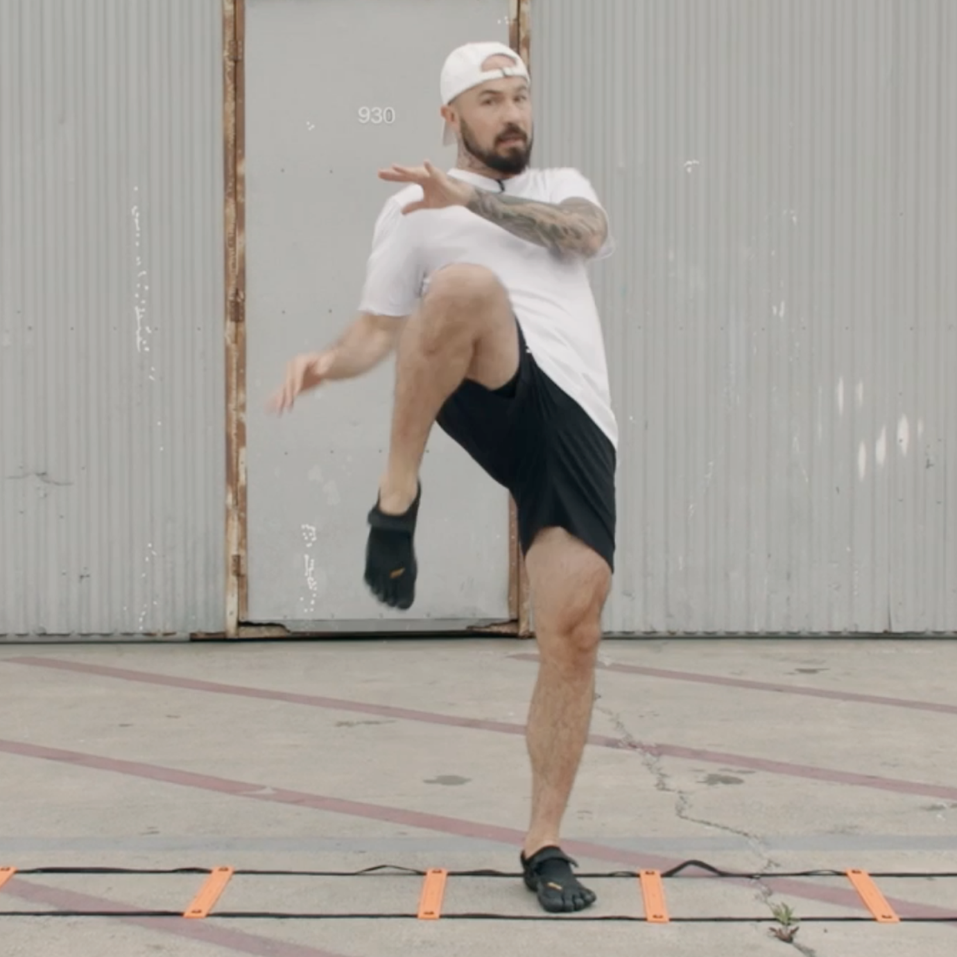Aaron Swenson Doing a Step In Knee Agility Ladder Drill 
