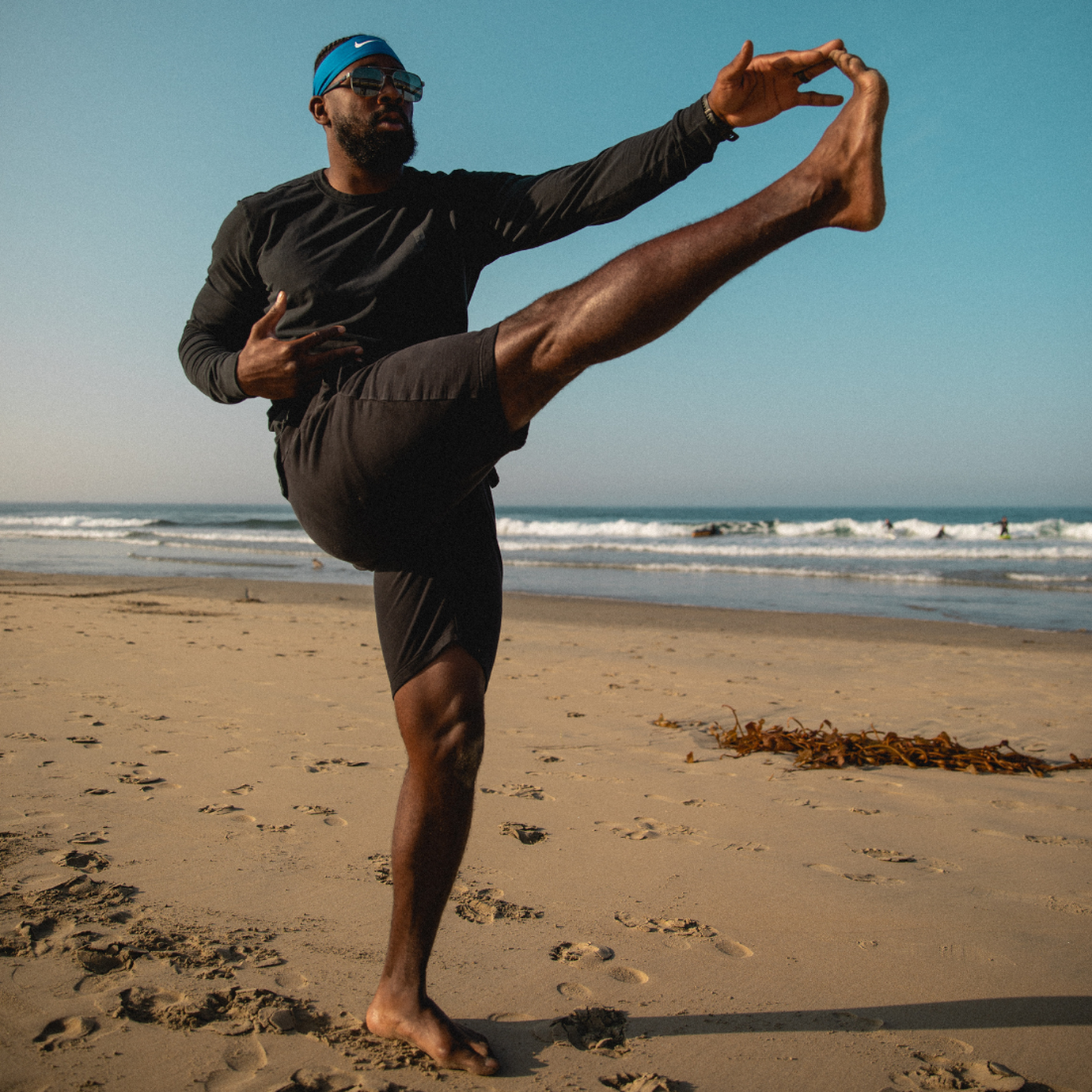 Coach PJ stretching at the beach