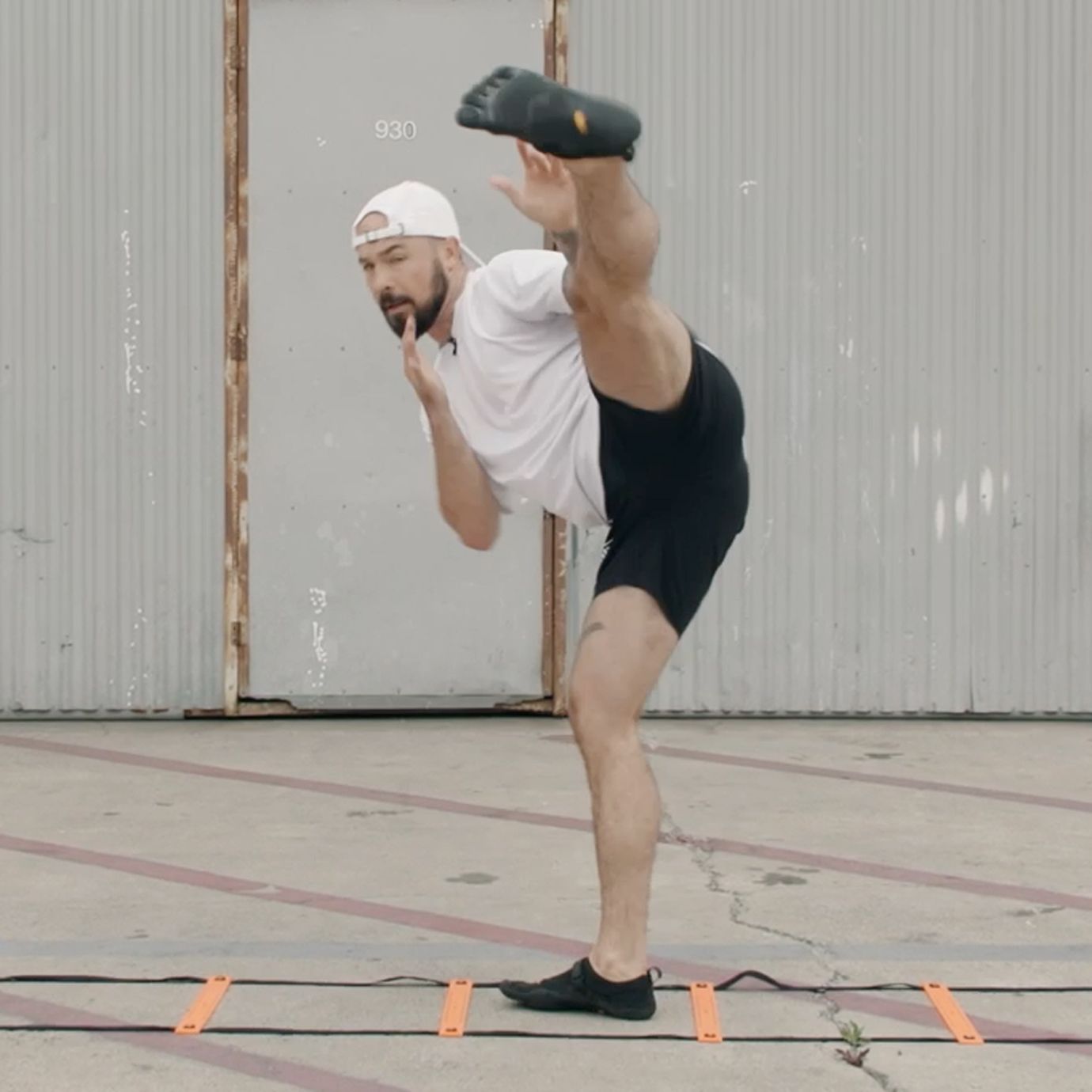 Aaron Swenson Doing a Pendulum Kick Agility Ladder Drill