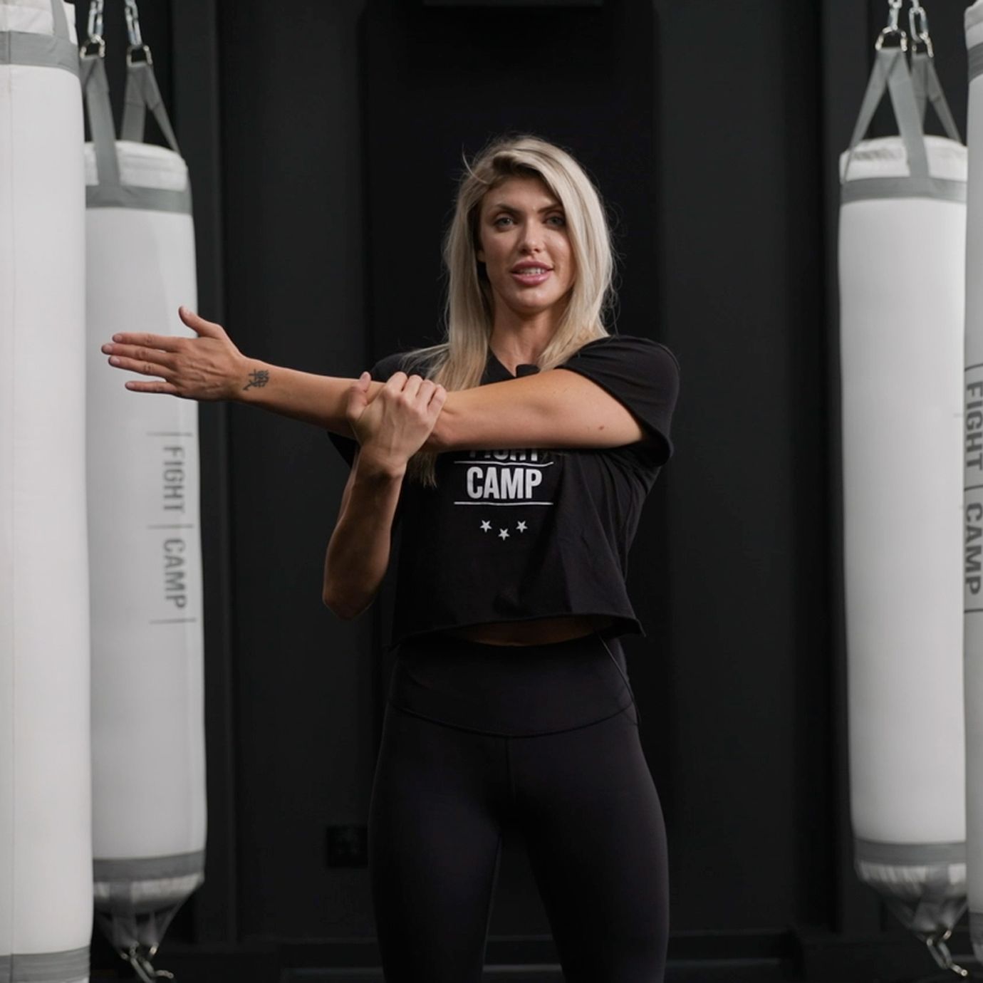 Shanie Smash Doing a Shoulder Pull Stretch