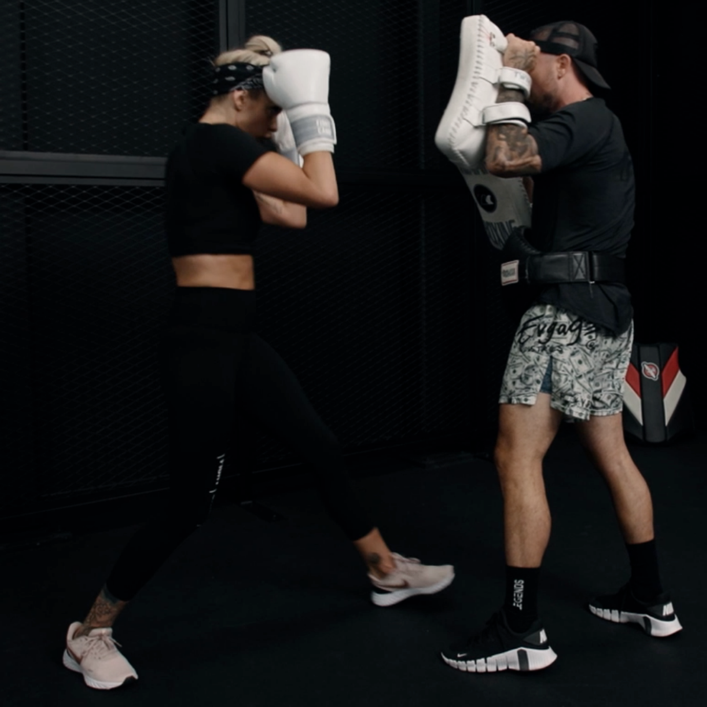 Aaron Swenson showing how to hold pads for elbows