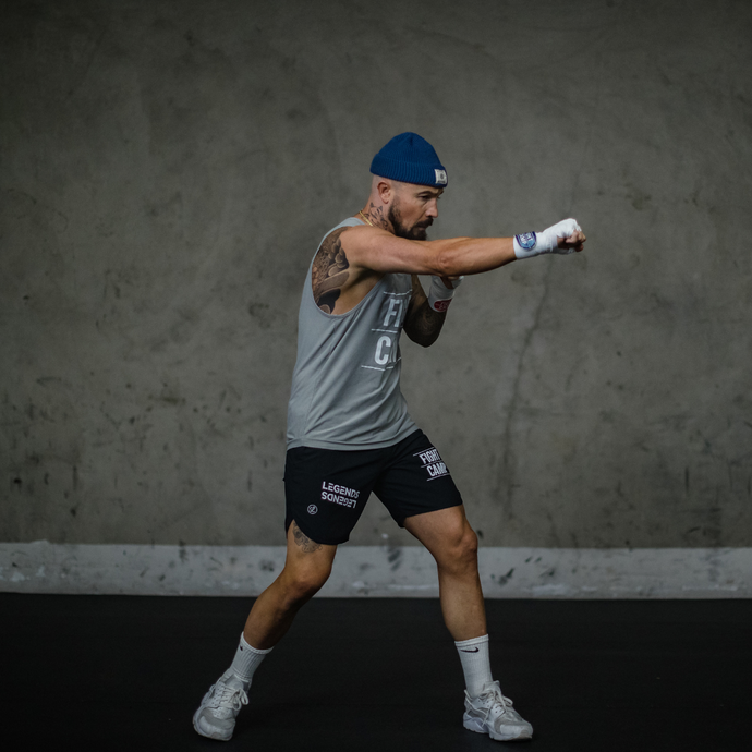 FightCamp Trainer Aaron Swenson Throwing a Cross Punch