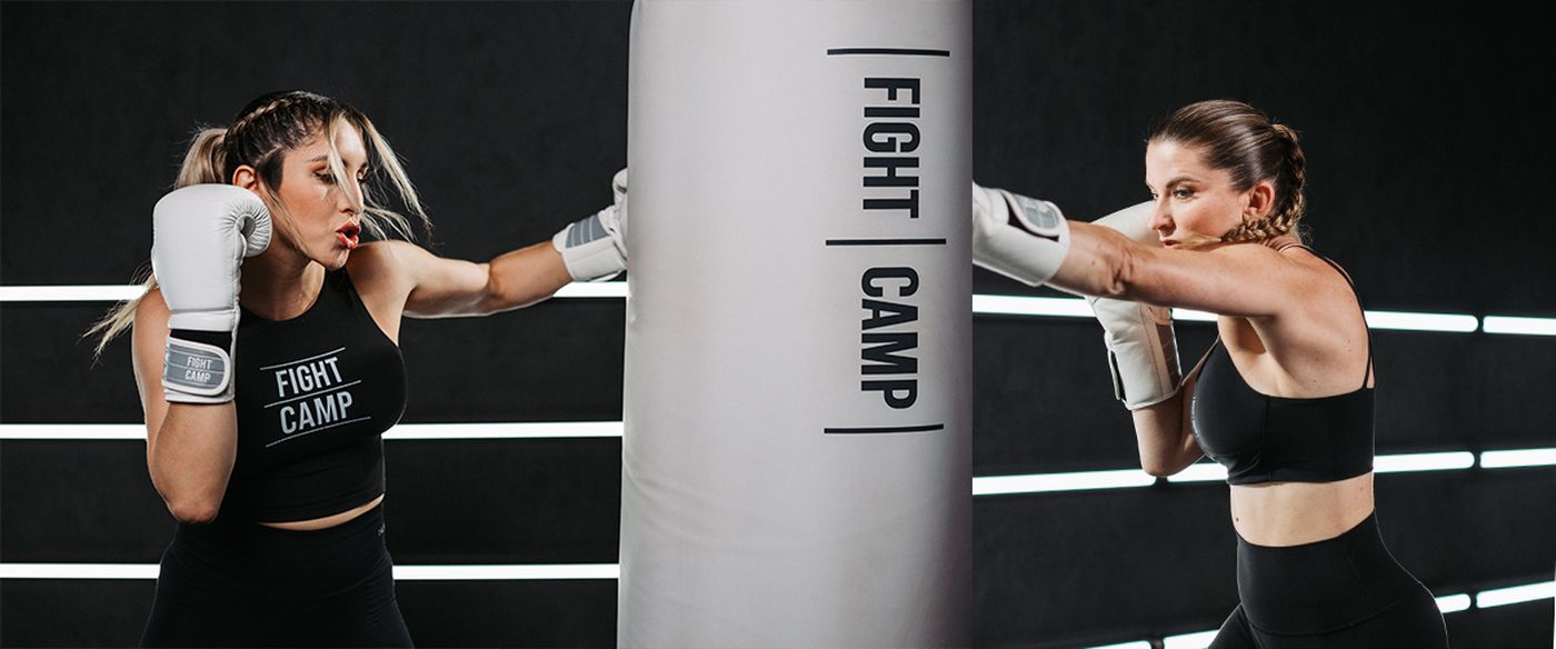 Coach Charlotte and Coach Selina punching FightCamp bag