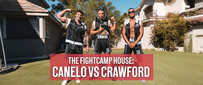 Three men in boxing attire pose confidently outside a house, with a banner reading "The FightCamp House: Canelo vs Crawford."