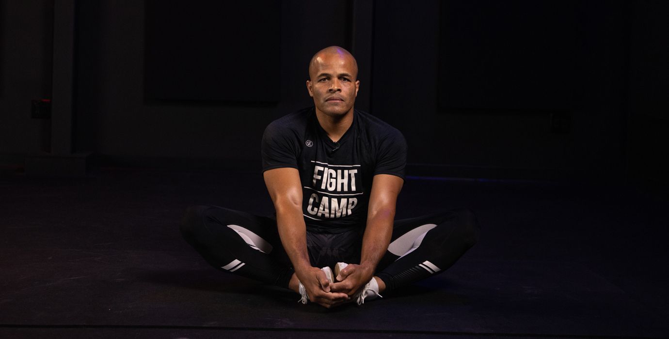 Flo Master Doing a Butterfly Stretch