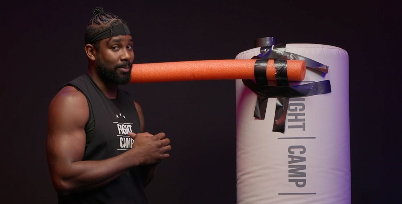 PJ Shirdan With Pool Noodle Taped To Boxing Heavy Bag