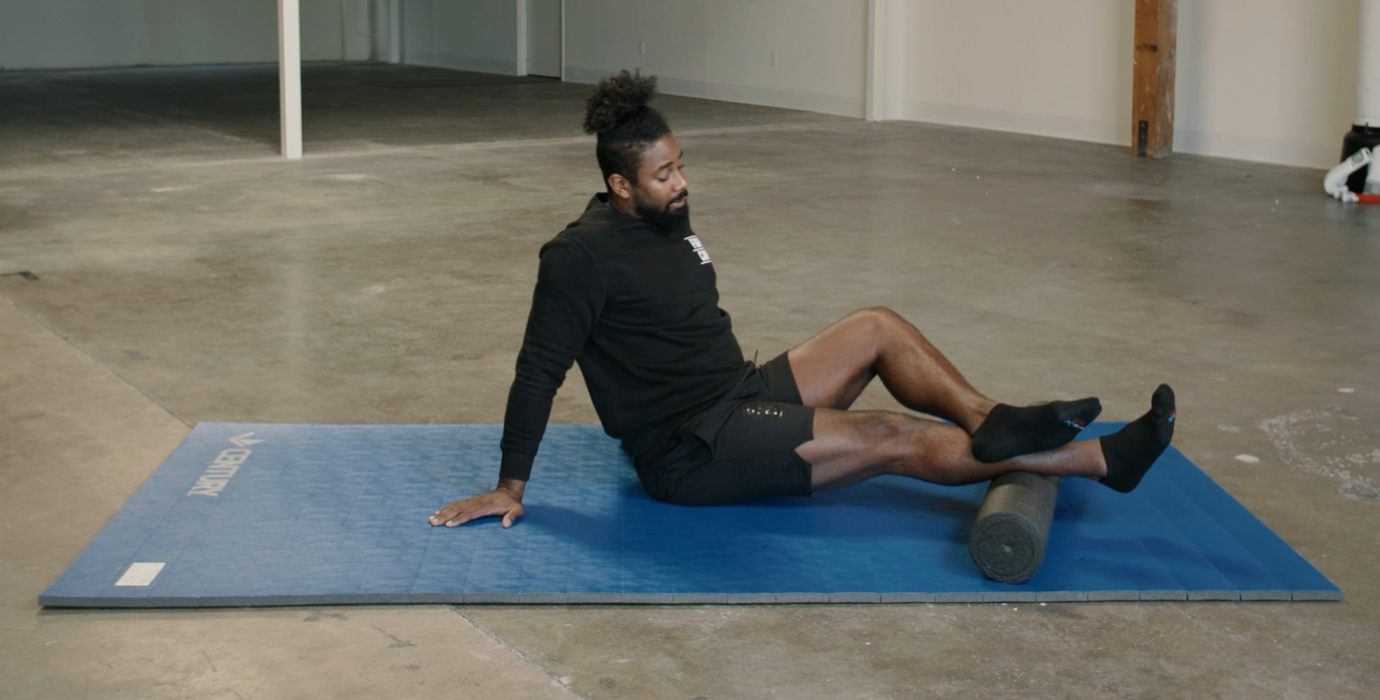 Coach PJ Doing Achilles and Calves Foam Rolls