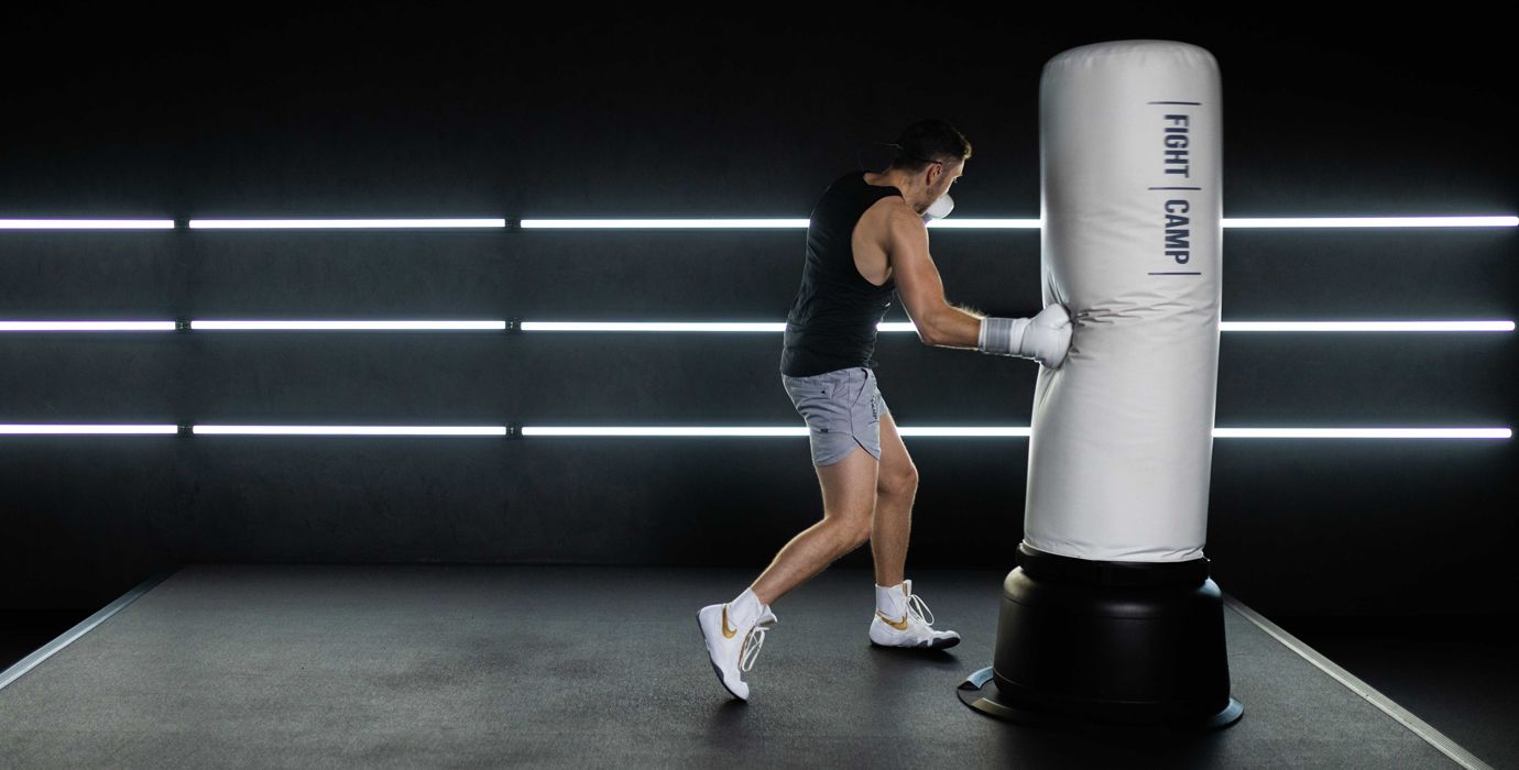 Tommy Duquette Throwing Punches On a Heavy Bag