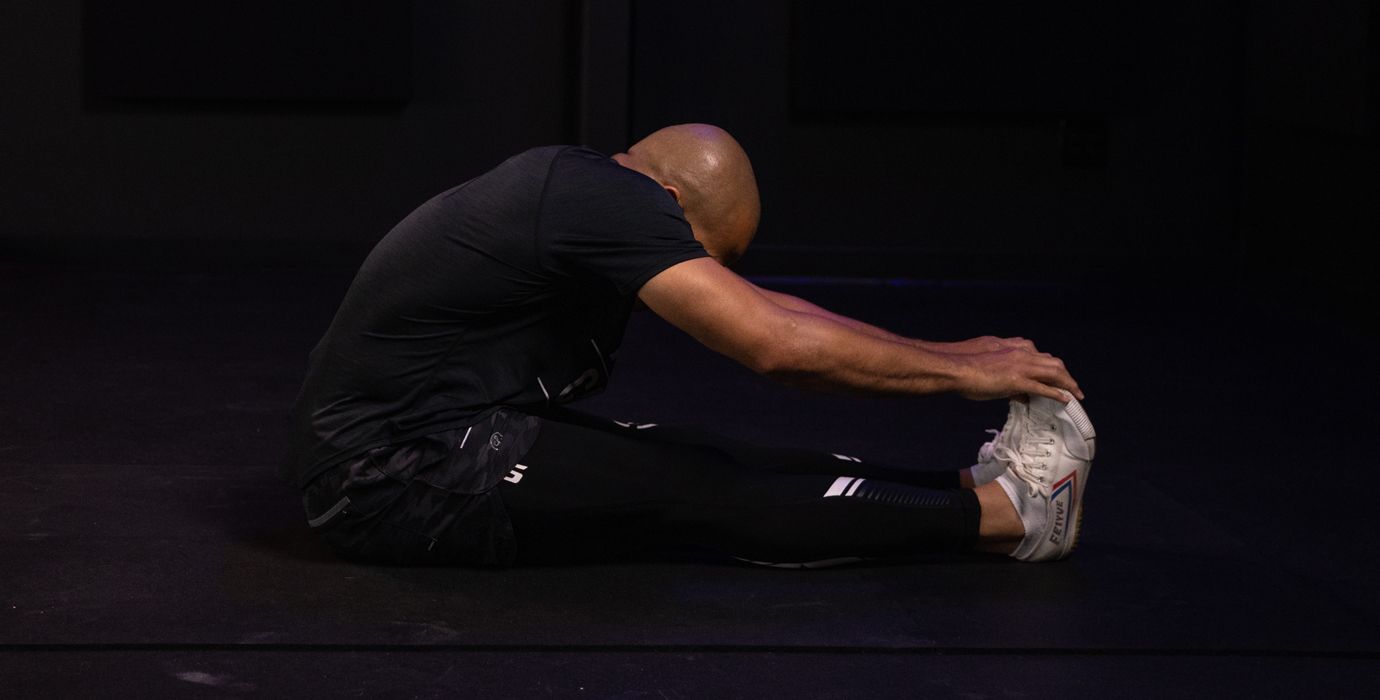 Flo Master Doing a Hamstring Stretch