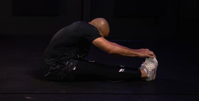 Flo Master Doing a Hamstring Stretch