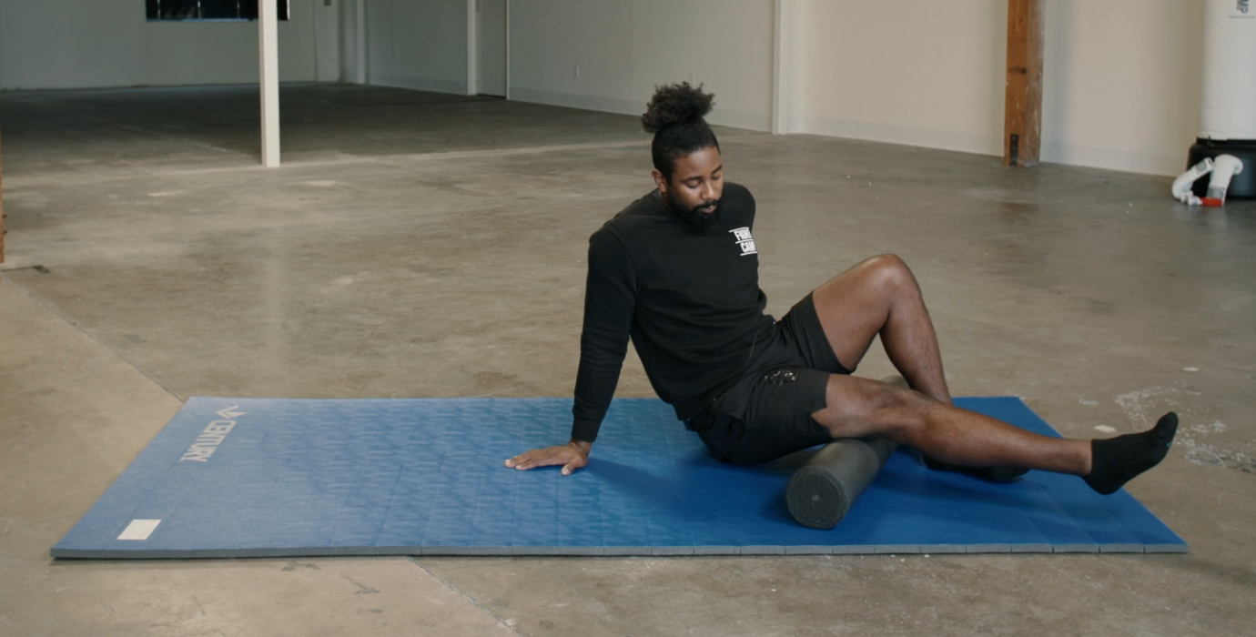 Coach PJ Doing Hamstring Foam Rolls