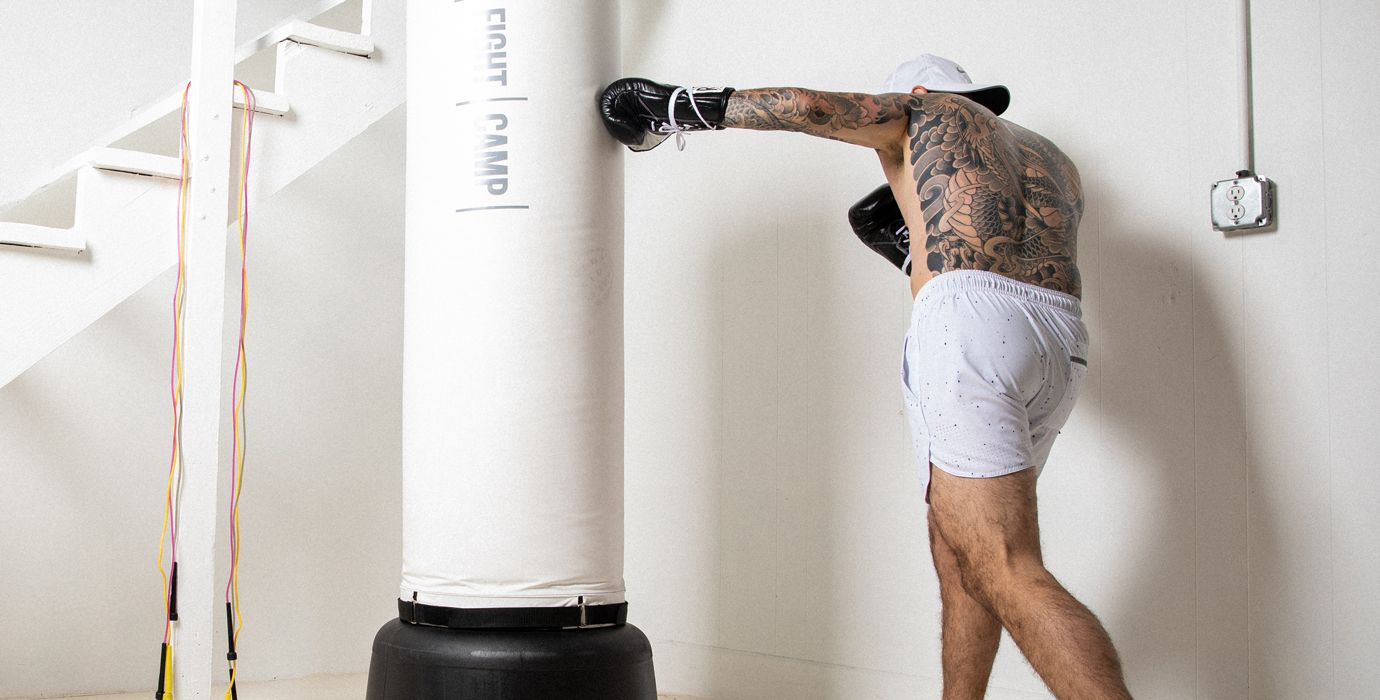 Aaron Swenson Throwing Punches On a Heavy Bag