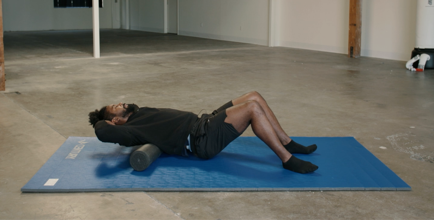 Coach PJ Doing Upper Back Foam Rolls