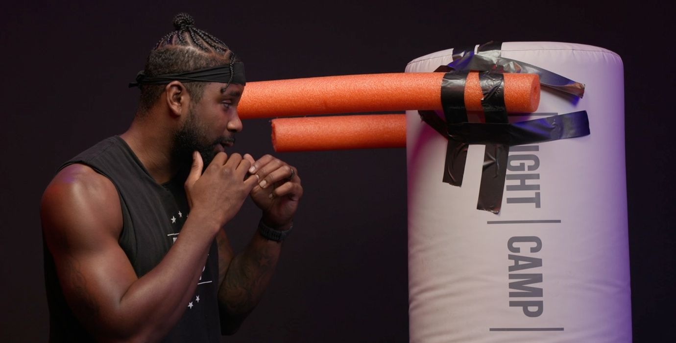 PJ Shirdan Practicing Boxing Drills With Heavy Bag and Pool Noodle