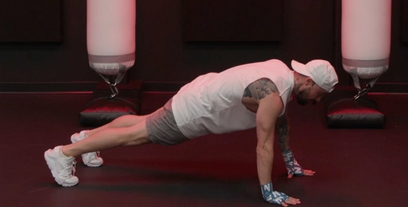Aaron Swenson Holding a High Plank