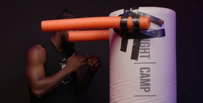 Coach PJ Doing a Roll Lead Boxing Movement