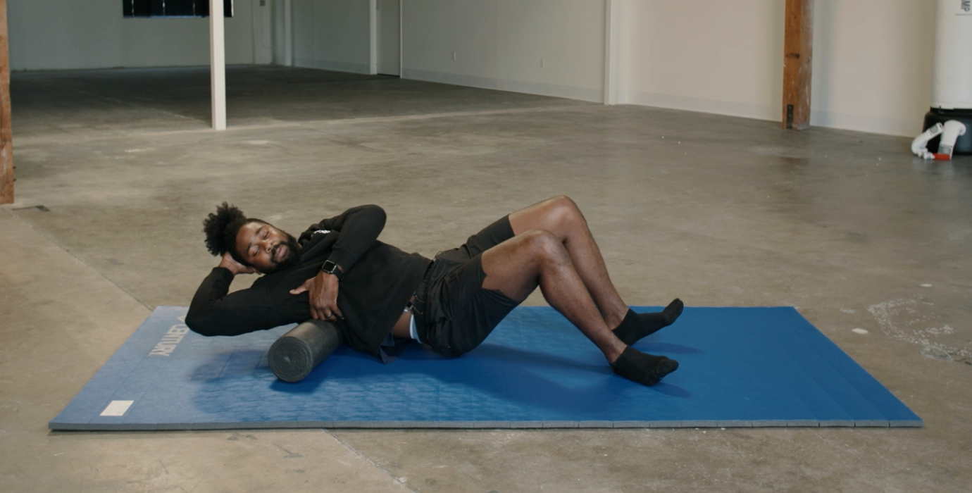 Coach PJ Doing Latissimus Dorsi Foam Rolls