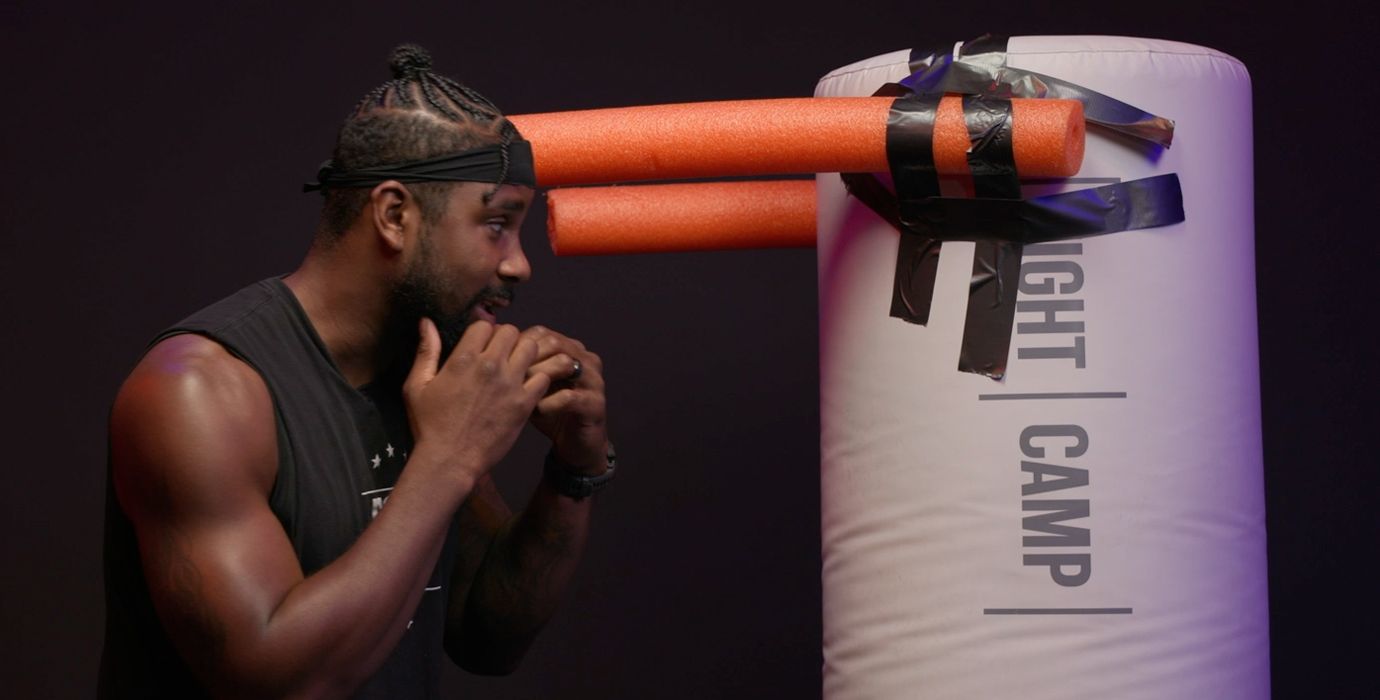 Coach PJ Doing a Rear Roll Boxing Movement