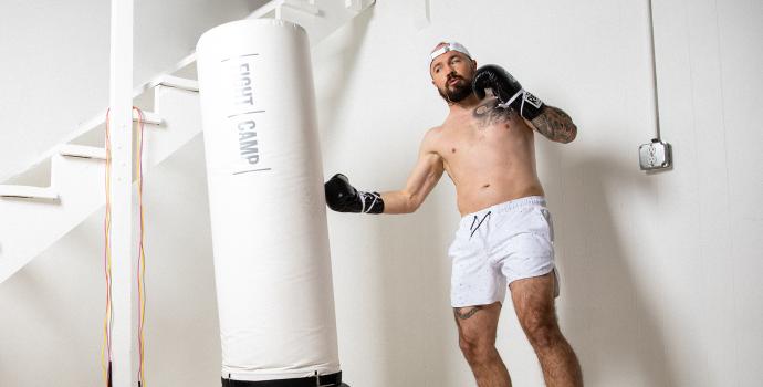 Aaron Swenson Hitting a Punching Bag