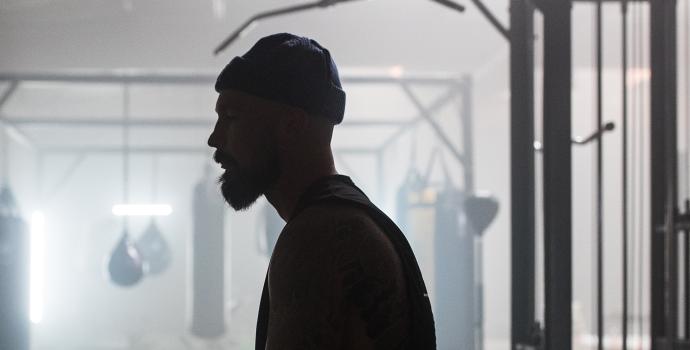 Aaron Swenson Sitting In Boxing Gym