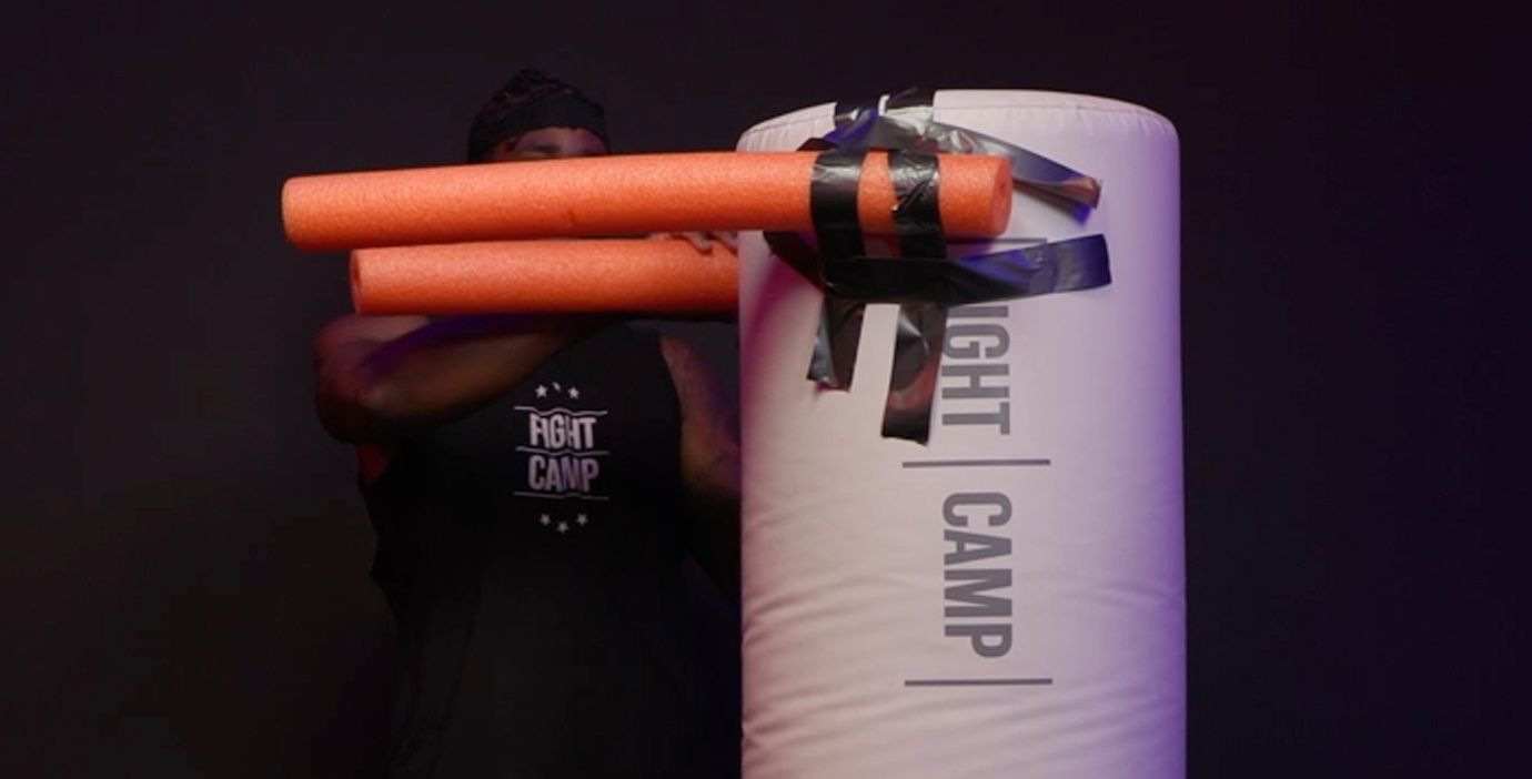 Coach PJ Adding Pool Noodles to a Punching Bag