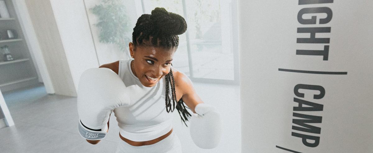 FightCamp - Woman Burning Calories Boxing