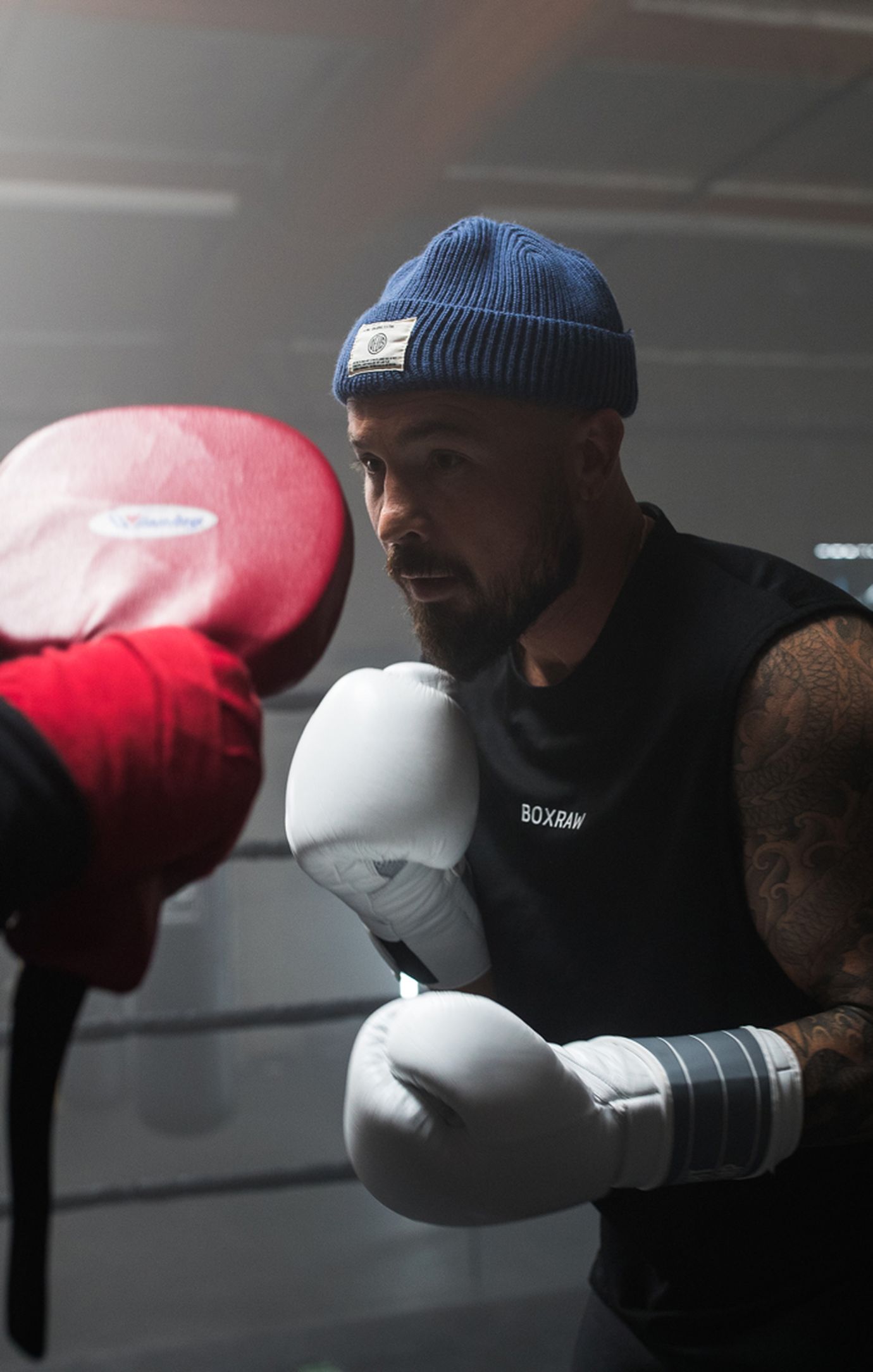 Aaron Swenson Doing Padwork For Boxing Training