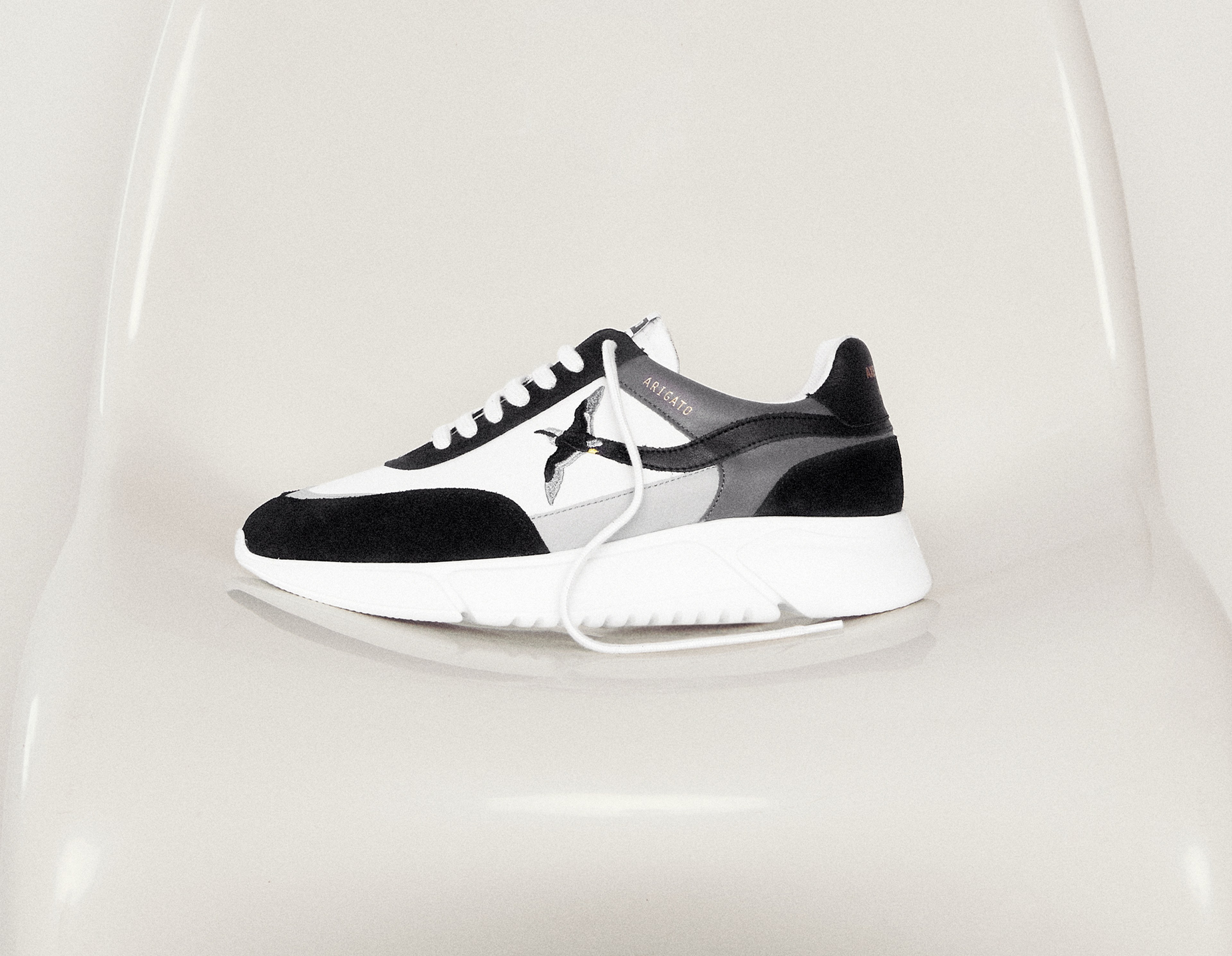 axel arigato genesis grey