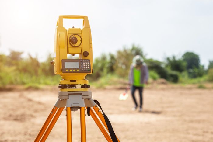 Land surveyor on the job