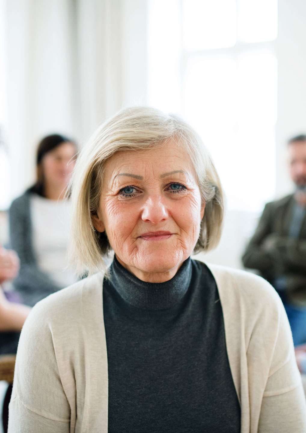 Senior woman in group therapy 