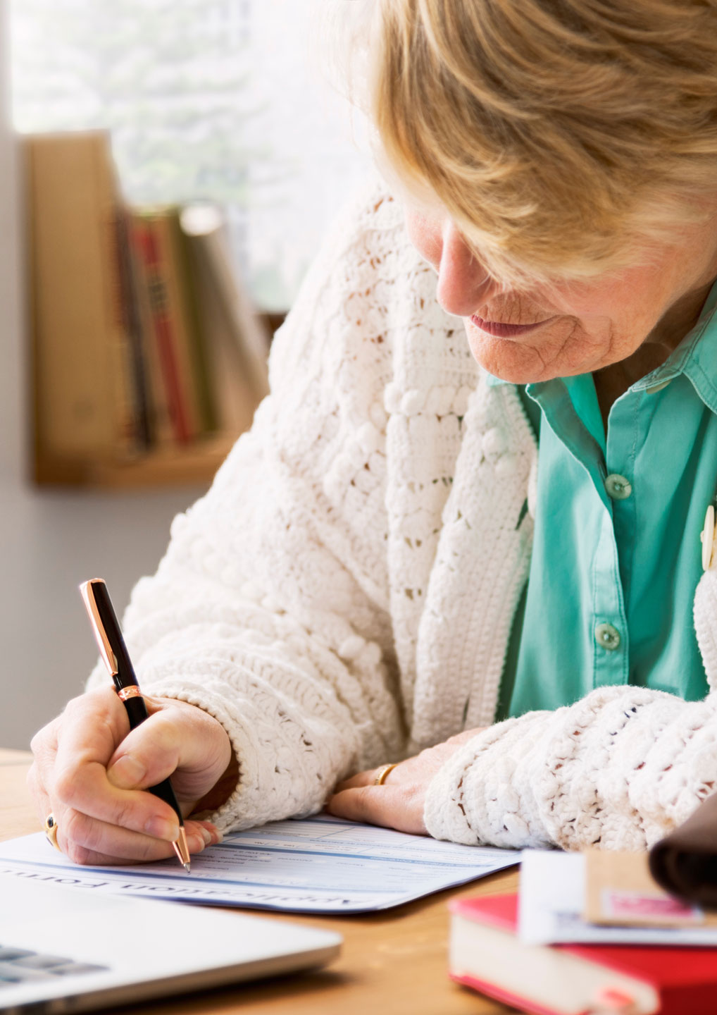 Senior Woman Filling out Documents