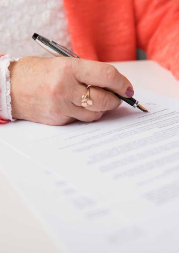 Senior woman filling out form