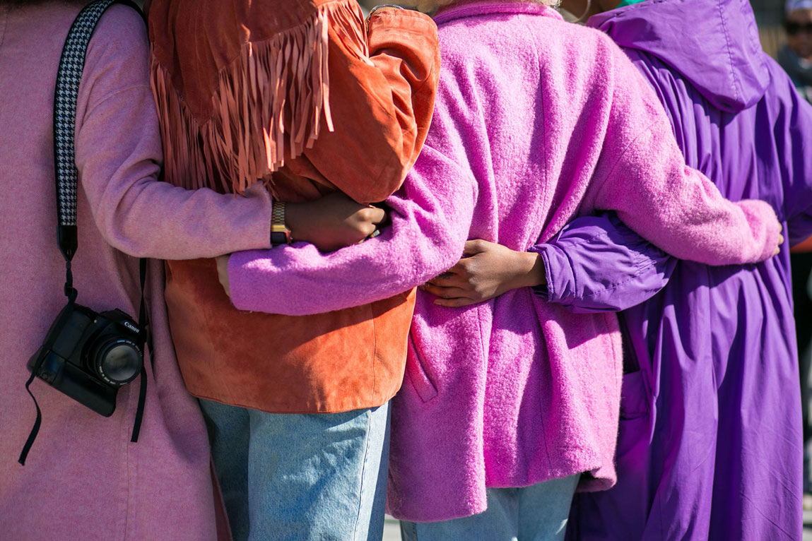 Group of women in purple jackets