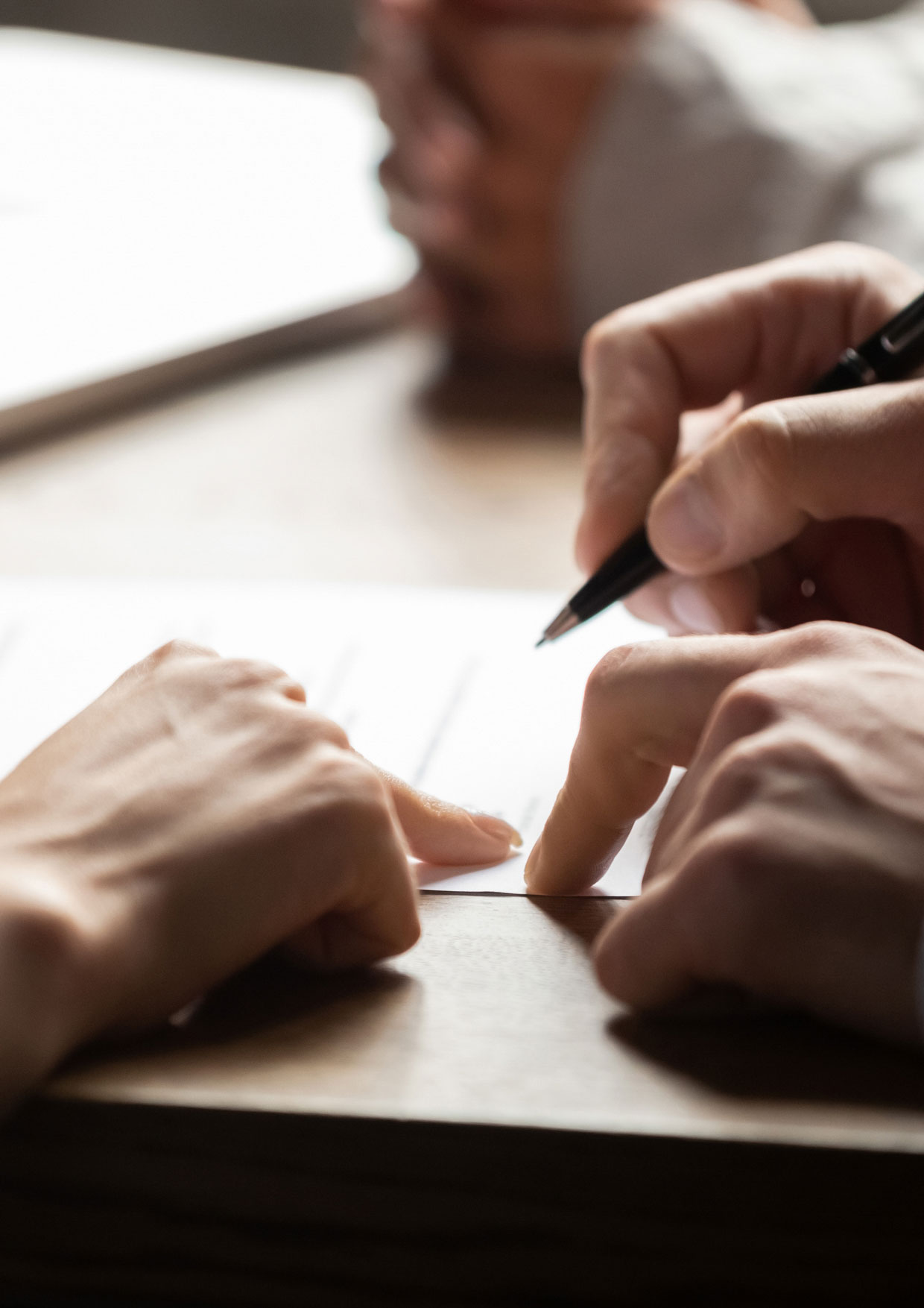 Solicitor and client signing paperwork