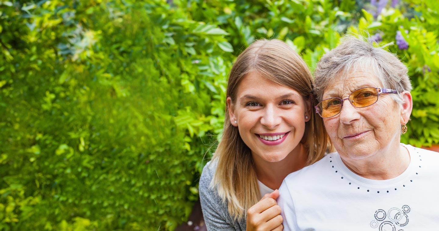 Image of a young woman and an older woman, who might be her grandmother