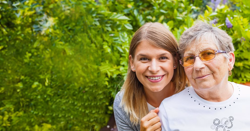 Image of a young woman and an older woman, who might be her grandmother