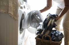 Senior woman doing a load of washing