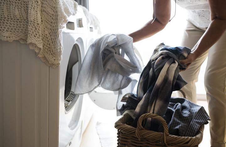 Senior woman doing a load of washing