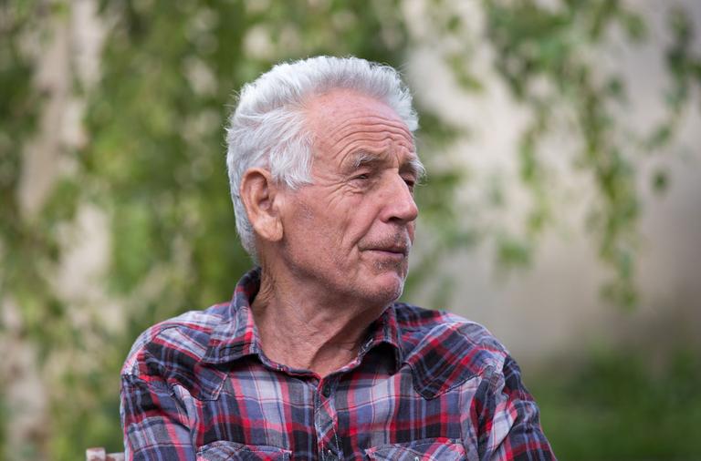 Portrait of older man in park